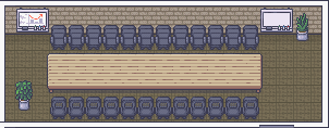 Sala de reunião com mesa comprida e cadeiras dos dois lados